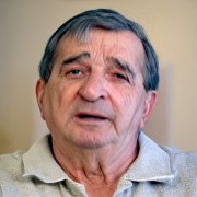 Older man with dark, graying hair